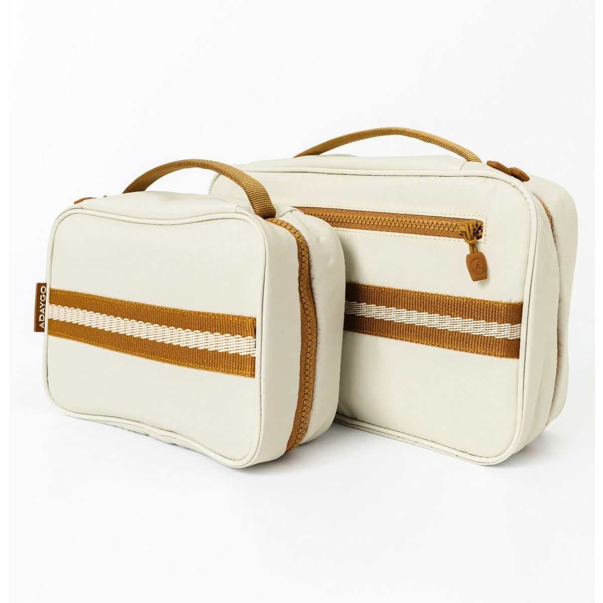 Two cream-colored travel pouches with tan handles and striped accents, displayed on a clean white background.