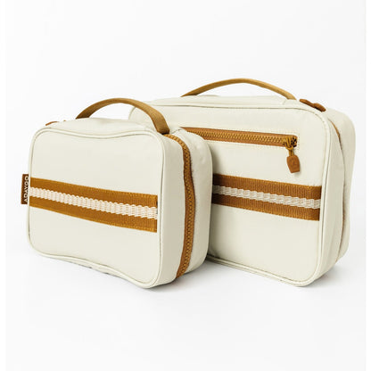Two cream-colored travel pouches with tan handles and striped accents, displayed on a clean white background.